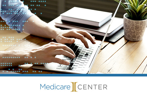 Medicare Center, Integrity, focus on hands typing on a laptop