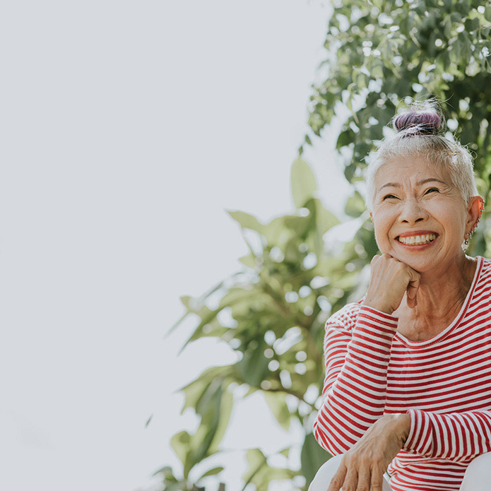 Senior woman outdoors and smiling